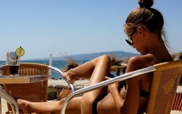 Thumb_21877-girl-tanning-on-the-beach